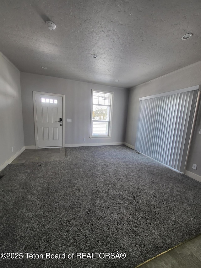 360 Wooden Spur Dr, Alpine, WY 83128 - carpeted spare room featuring a smoke detector and a textured ceiling