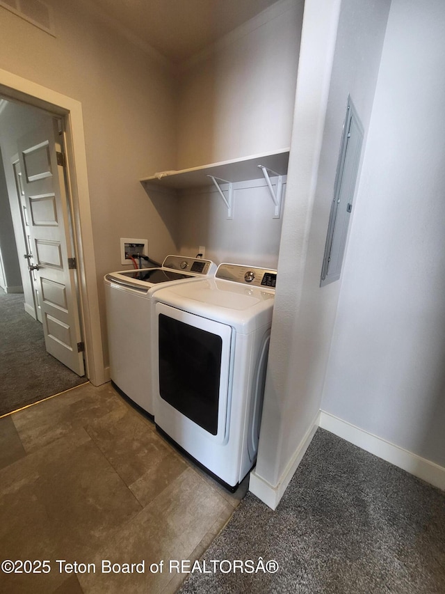 360 Wooden Spur Dr, Alpine, WY 83128 - washroom featuring washing machine and clothes dryer, electric panel, and dark colored carpet