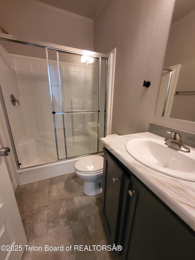 360 Wooden Spur Dr, Alpine, WY 83128 - full bathroom featuring vanity, a stall shower, and a textured wall