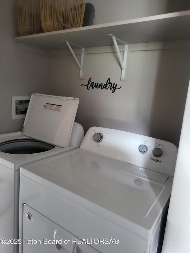 360 Wooden Spur Dr, Alpine, WY 83128 - laundry room featuring washing machine and clothes dryer