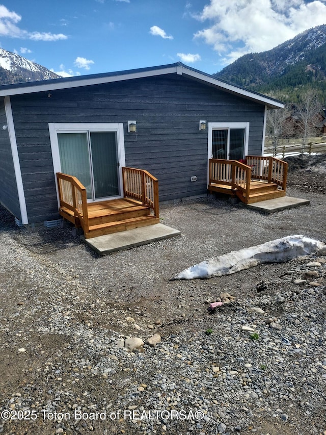 360 Wooden Spur Dr, Alpine, WY 83128 - back of house featuring a deck with mountain view