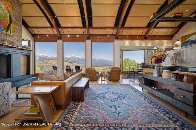1987 N Spirit Dance Rd, Jackson, WY 83001 - living area featuring wood finished floors, healthy amount of natural light, and a mountain view