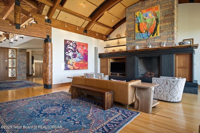1987 N Spirit Dance Rd, Jackson, WY 83001 - living area with wood finished floors, beam ceiling, high vaulted ceiling, and baseboards