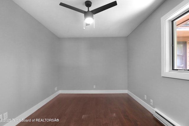 512 S Millward Unit 512, Jackson, WY 83001 - spare room with ceiling fan, a baseboard radiator, dark wood finished floors, and baseboards
