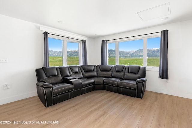 315 Meyers St, Thayne, WY 83127 - living room featuring a mountain view and light wood-style flooring