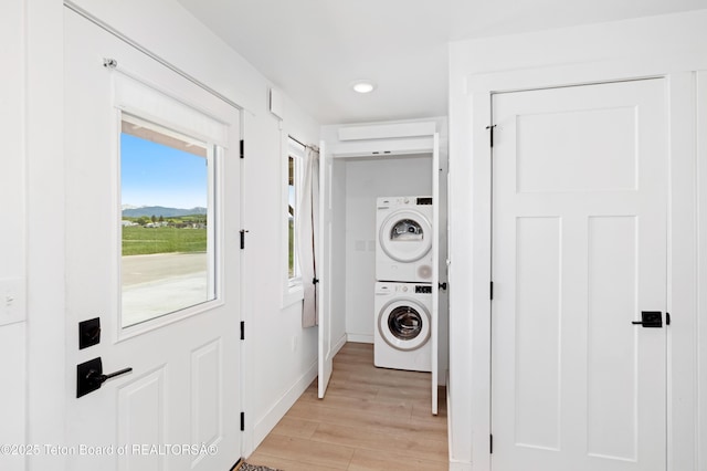 315 Meyers St, Thayne, WY 83127 - laundry area featuring stacked washer and clothes dryer, light wood finished floors, and recessed lighting