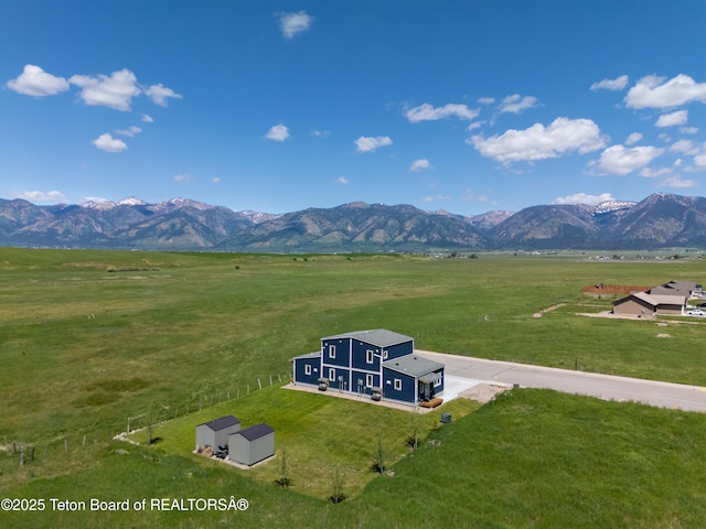 315 Meyers St, Thayne, WY 83127 - aerial view of sparsely populated area featuring a mountainous background and agricultural land