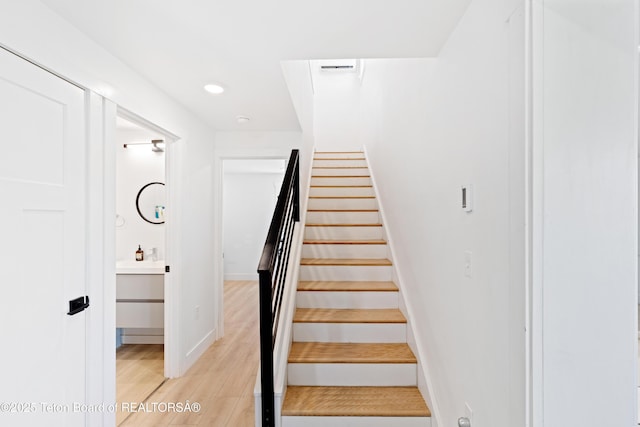 315 Meyers St, Thayne, WY 83127 - staircase featuring wood finished floors and recessed lighting
