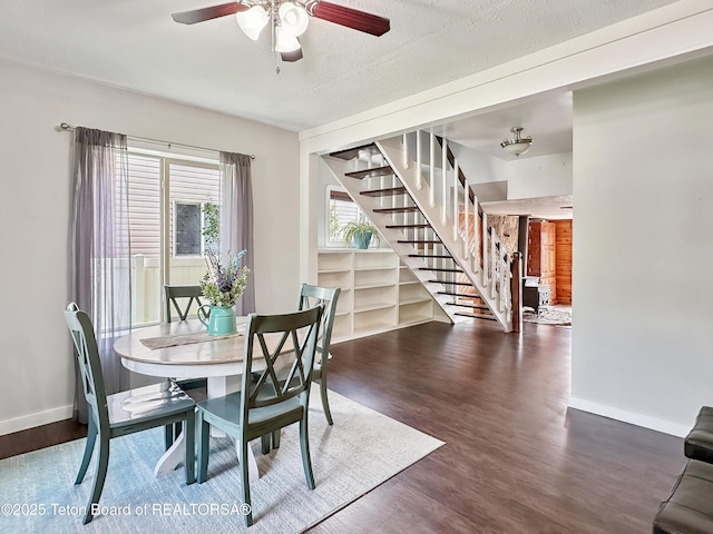 566 Jefferson St, Afton, WY 83110 - dining area featuring stairway, wood finished floors, and ceiling fan