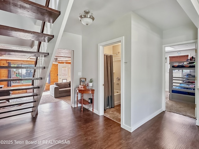 566 Jefferson St, Afton, WY 83110 - entryway with wood finished floors, stairway, and plenty of natural light
