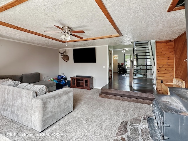 566 Jefferson St, Afton, WY 83110 - living room with ceiling fan, a textured ceiling, and carpet flooring