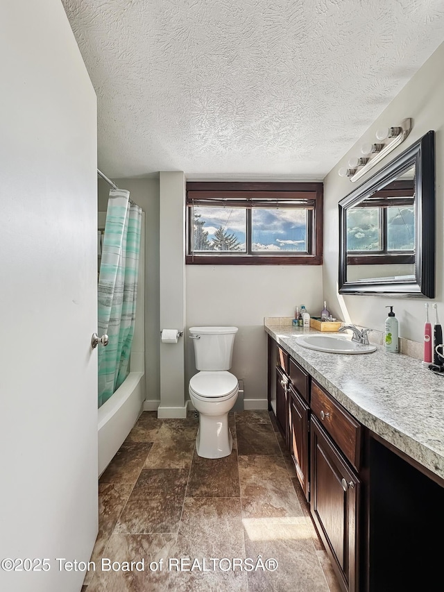 566 Jefferson St, Afton, WY 83110 - bathroom with vanity, shower / bath combination with curtain, healthy amount of natural light, a textured ceiling, and stone finish flooring