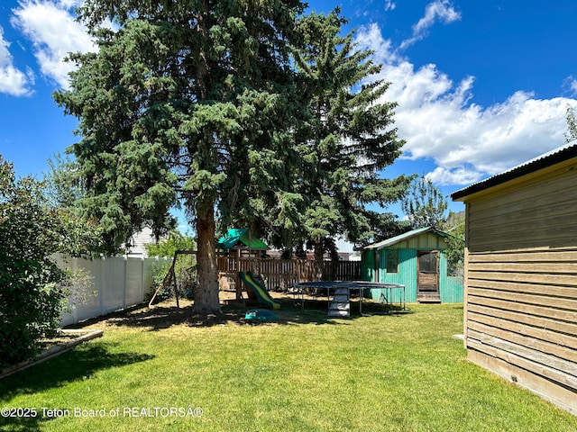 566 Jefferson St, Afton, WY 83110 - fenced backyard featuring a playground and a storage shed