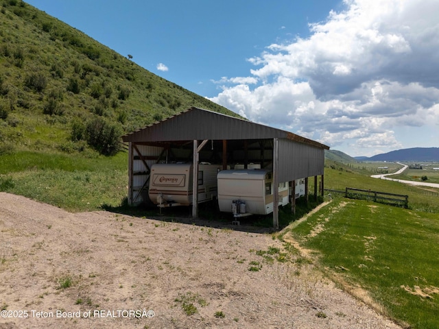 2840 E Dry Crk, Afton, WY 83110 - view of pole building featuring dirt driveway, a mountain view, and a detached carport