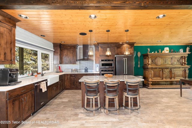 2840 E Dry Crk, Afton, WY 83110 - kitchen with wall chimney range hood, stainless steel appliances, wooden ceiling, a kitchen island, and light wood-style flooring