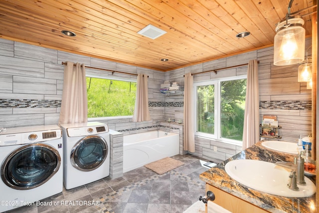 2840 E Dry Crk, Afton, WY 83110 - laundry room with washer and dryer, wood ceiling, and wooden walls