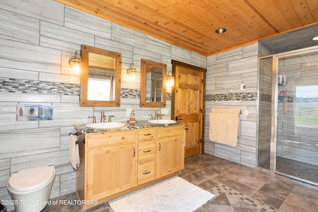 2840 E Dry Crk, Afton, WY 83110 - full bathroom with wood ceiling, double vanity, a shower stall, and tile walls