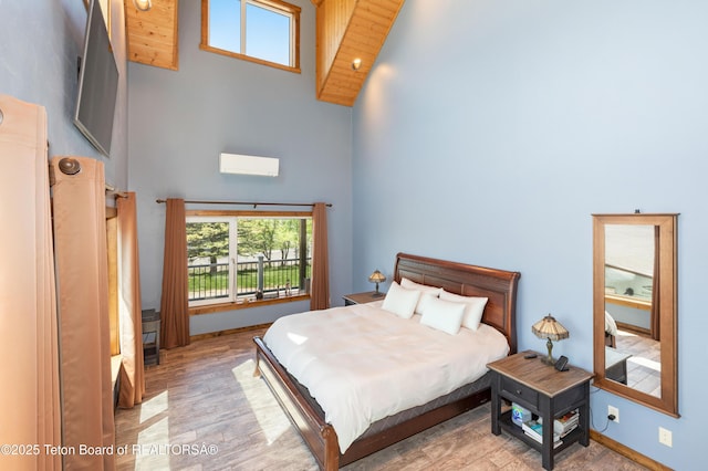 2840 E Dry Crk, Afton, WY 83110 - bedroom with high vaulted ceiling and wood finished floors