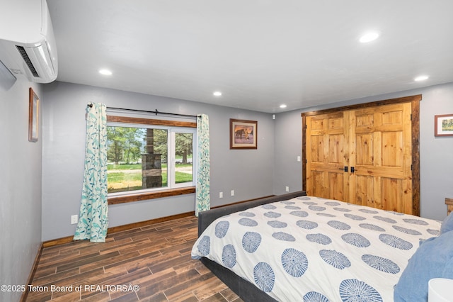 2840 E Dry Crk, Afton, WY 83110 - bedroom with an AC wall unit, recessed lighting, and wood finished floors