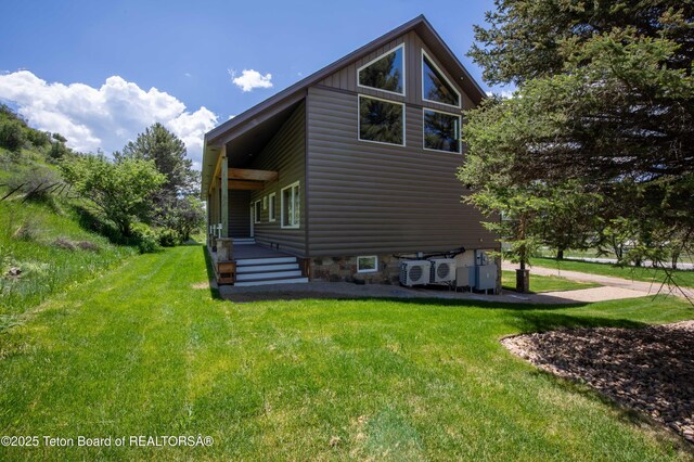 2840 E Dry Crk, Afton, WY 83110 - view of property exterior with a yard and log veneer siding