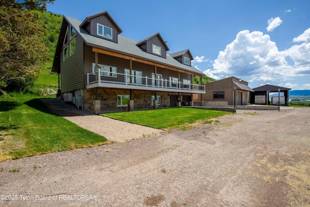 2840 E Dry Crk, Afton, WY 83110 - view of front facade featuring a front yard, driveway, a deck, and a detached garage