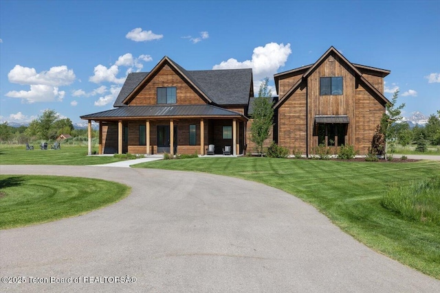 346 S Leigh Ranch Rd, Tetonia, ID 83452 - view of front of home featuring covered porch, a front lawn, and curved driveway