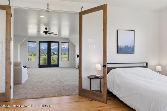 346 S Leigh Ranch Rd, Tetonia, ID 83452 - carpeted bedroom featuring access to exterior, french doors, and wood finished floors