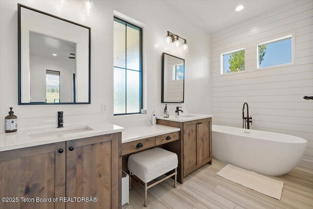 346 S Leigh Ranch Rd, Tetonia, ID 83452 - full bathroom with plenty of natural light, two vanities, a soaking tub, and recessed lighting