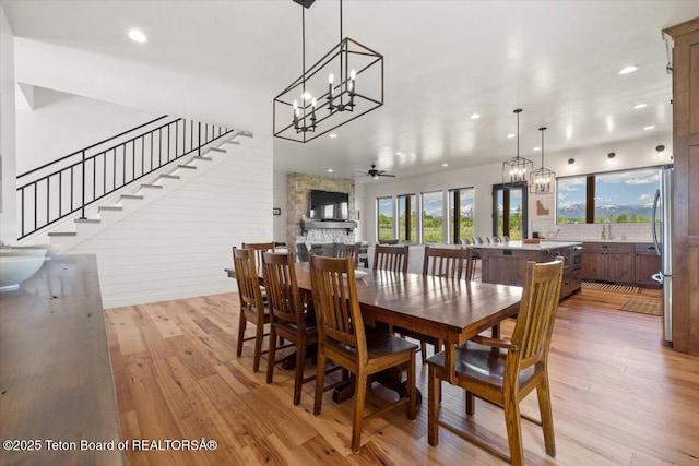 346 S Leigh Ranch Rd, Tetonia, ID 83452 - dining area with a chandelier, recessed lighting, light wood-type flooring, stairs, and a ceiling fan