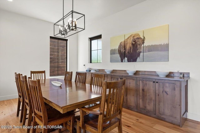 346 S Leigh Ranch Rd, Tetonia, ID 83452 - dining space with light wood-type flooring and a chandelier