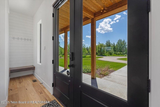 346 S Leigh Ranch Rd, Tetonia, ID 83452 - doorway to outside with light wood-style flooring and wood ceiling