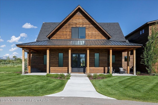 346 S Leigh Ranch Rd, Tetonia, ID 83452 - view of front facade with a porch, a standing seam roof, a front lawn, french doors, and a metal roof