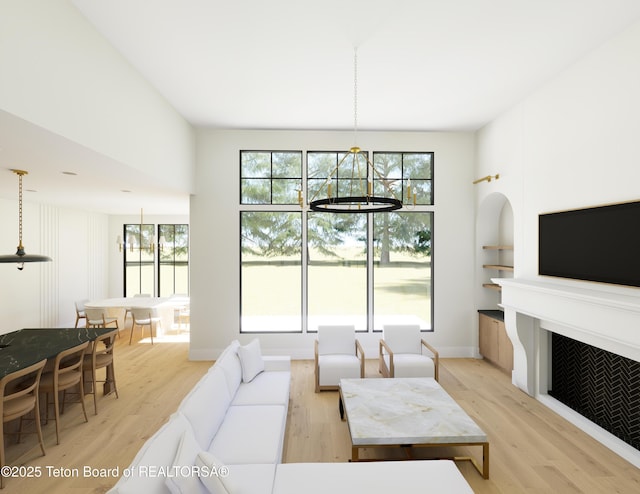 7 Cold Springs Rd, Victor, ID 83455 - living room featuring light wood finished floors, healthy amount of natural light, and a fireplace