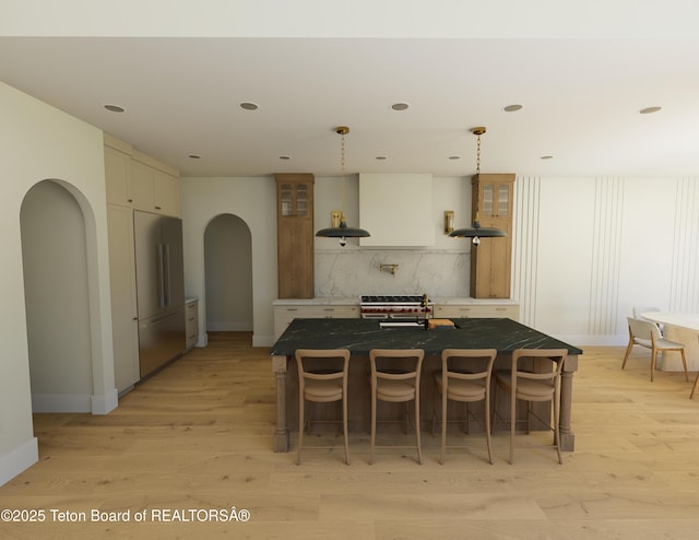 7 Cold Springs Rd, Victor, ID 83455 - dining space with arched walkways, light wood-style floors, and recessed lighting