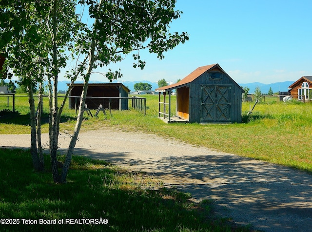 135 Butler Ln, Driggs, ID 83422 - view of yard featuring an outdoor structure and a mountain view