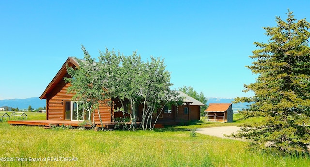 135 Butler Ln, Driggs, ID 83422 - back of house with a deck and faux log siding