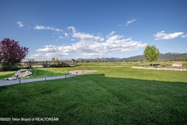 891 Paiute St, Driggs, ID 83422 - view of grassy yard featuring a mountain view and a rural view