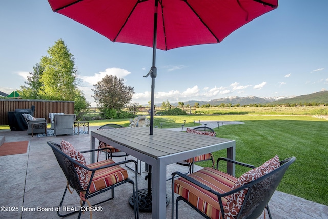891 Paiute St, Driggs, ID 83422 - view of patio / terrace featuring outdoor dining area and a mountain view