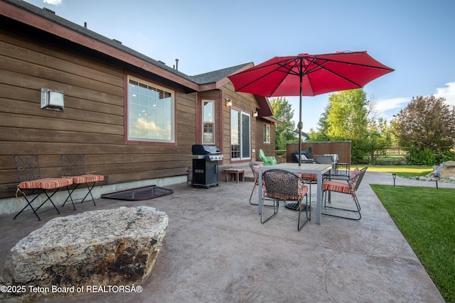 891 Paiute St, Driggs, ID 83422 - view of patio featuring area for grilling and outdoor dining area