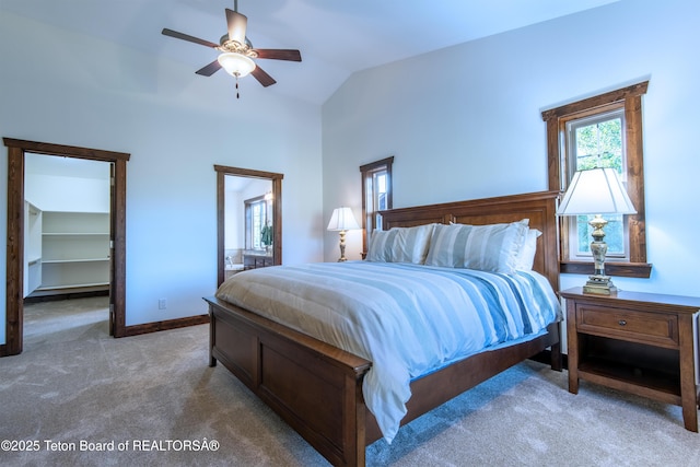 891 Paiute St, Driggs, ID 83422 - carpeted bedroom featuring a walk in closet, lofted ceiling, ensuite bath, and a ceiling fan
