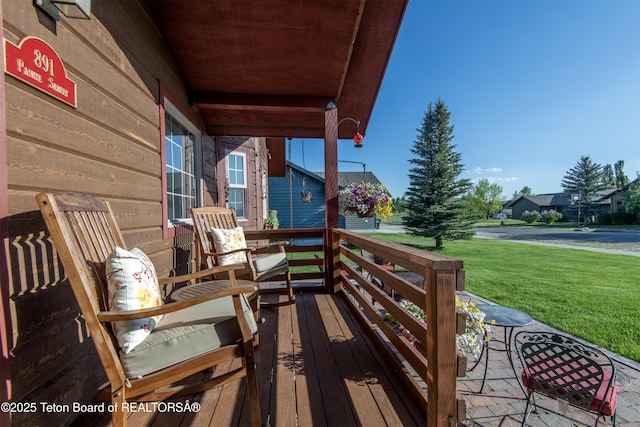 891 Paiute St, Driggs, ID 83422 - wooden deck with a yard