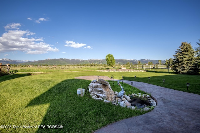 891 Paiute St, Driggs, ID 83422 - view of grassy yard featuring a mountain view and a rural view