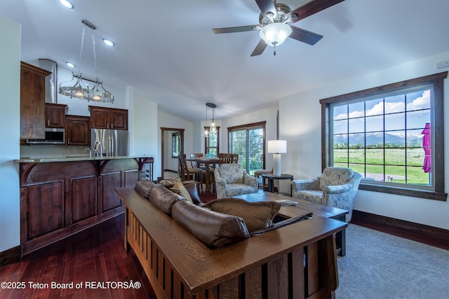 891 Paiute St, Driggs, ID 83422 - living room with dark wood-type flooring, vaulted ceiling, ceiling fan, and recessed lighting