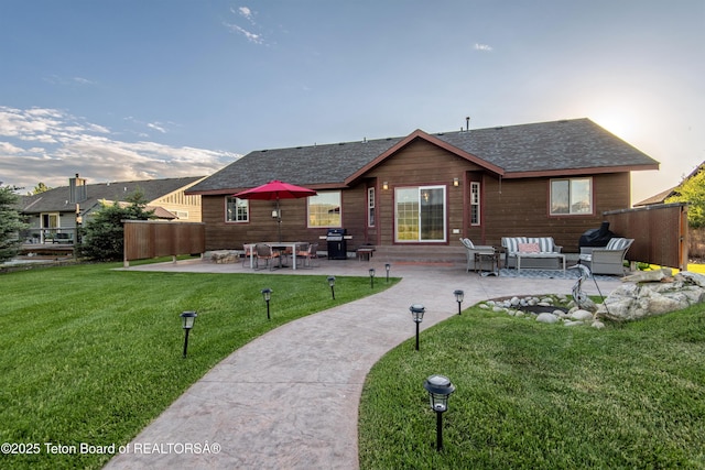 891 Paiute St, Driggs, ID 83422 - rear view of property with an outdoor living space, a patio, a yard, and a shingled roof