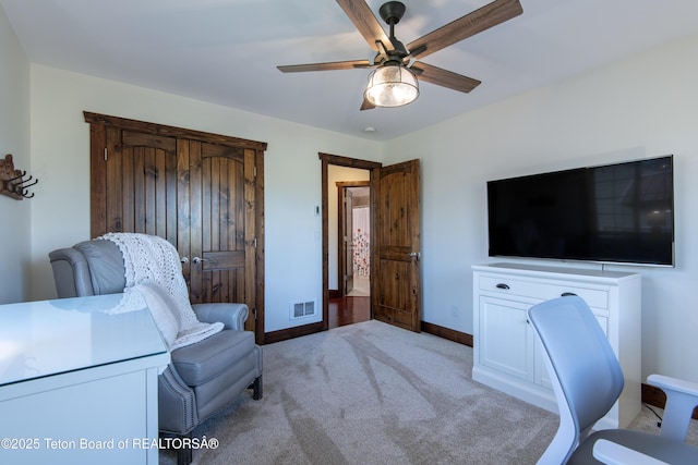 891 Paiute St, Driggs, ID 83422 - home office featuring a ceiling fan and light colored carpet