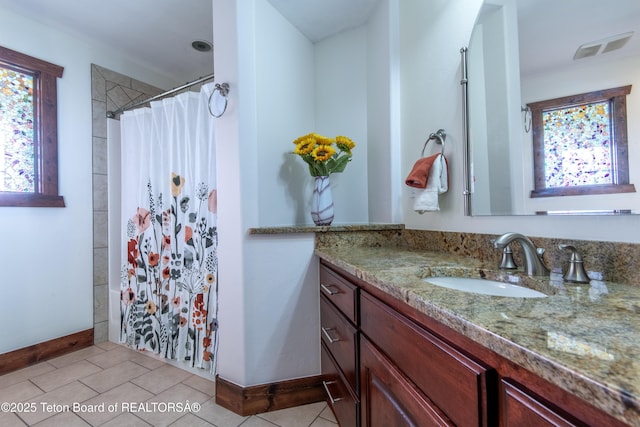 891 Paiute St, Driggs, ID 83422 - full bath with vanity, curtained shower, and tile patterned flooring