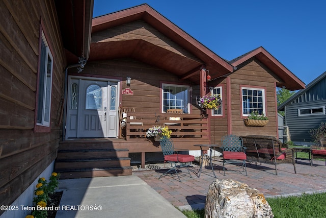 891 Paiute St, Driggs, ID 83422 - view of exterior entry featuring a patio area