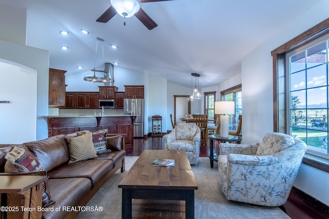 891 Paiute St, Driggs, ID 83422 - living room with vaulted ceiling, ceiling fan, a chandelier, and wood finished floors