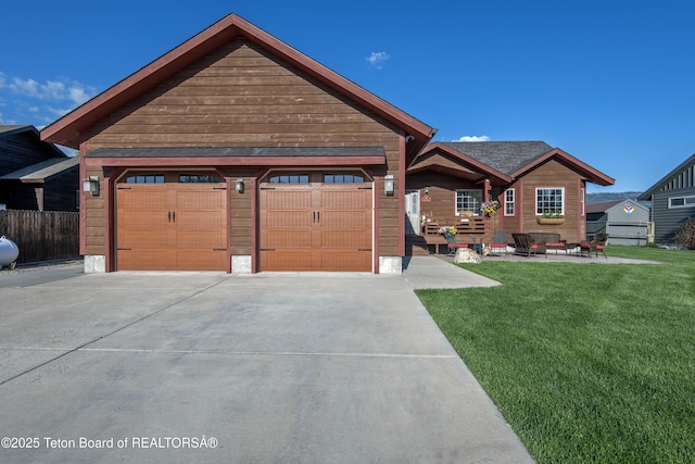 891 Paiute St, Driggs, ID 83422 - view of front of home with driveway and a front yard