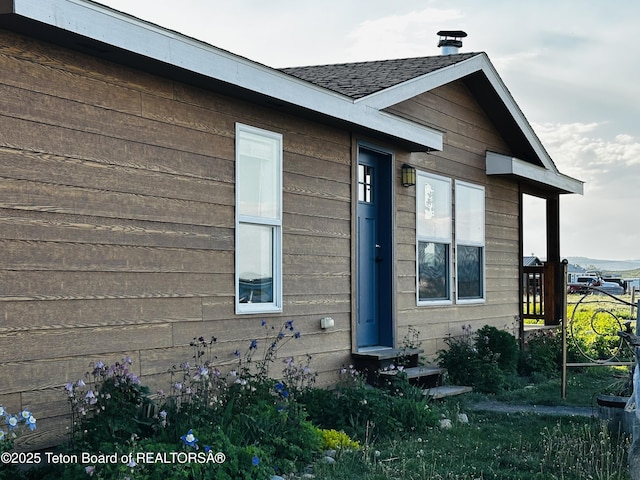 27 Chief Joseph, Daniel, WY 83115 - view of property exterior featuring entry steps and roof with shingles